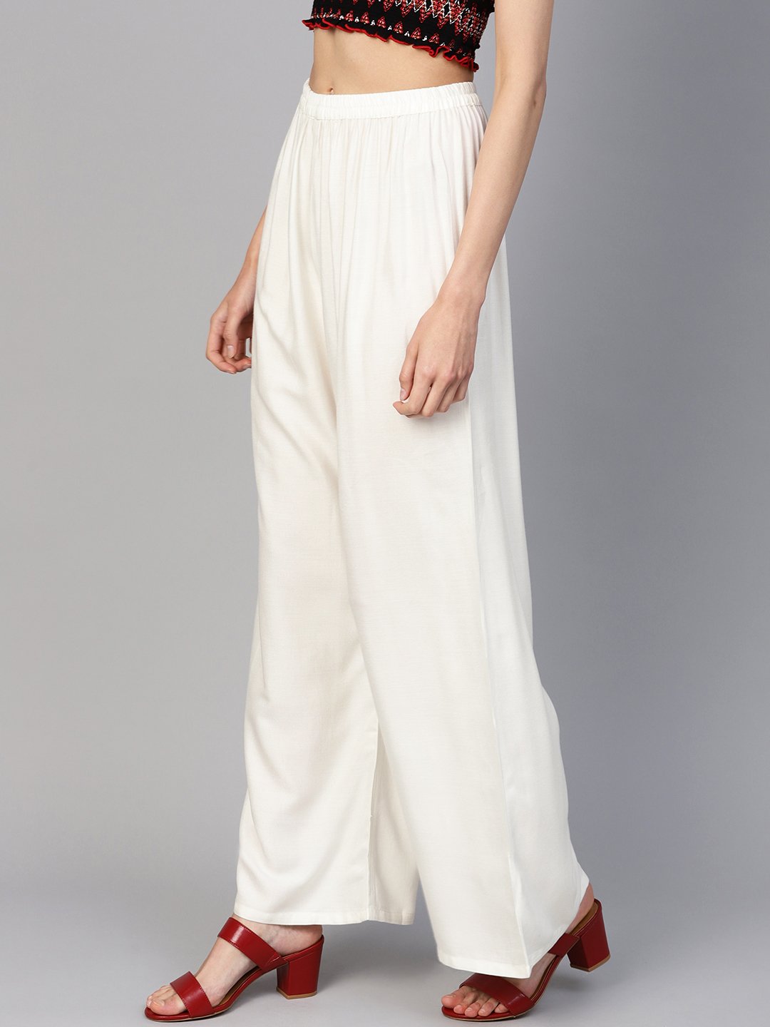 Jompers Women Off-White Solid Straight Palazzos | Grocsy