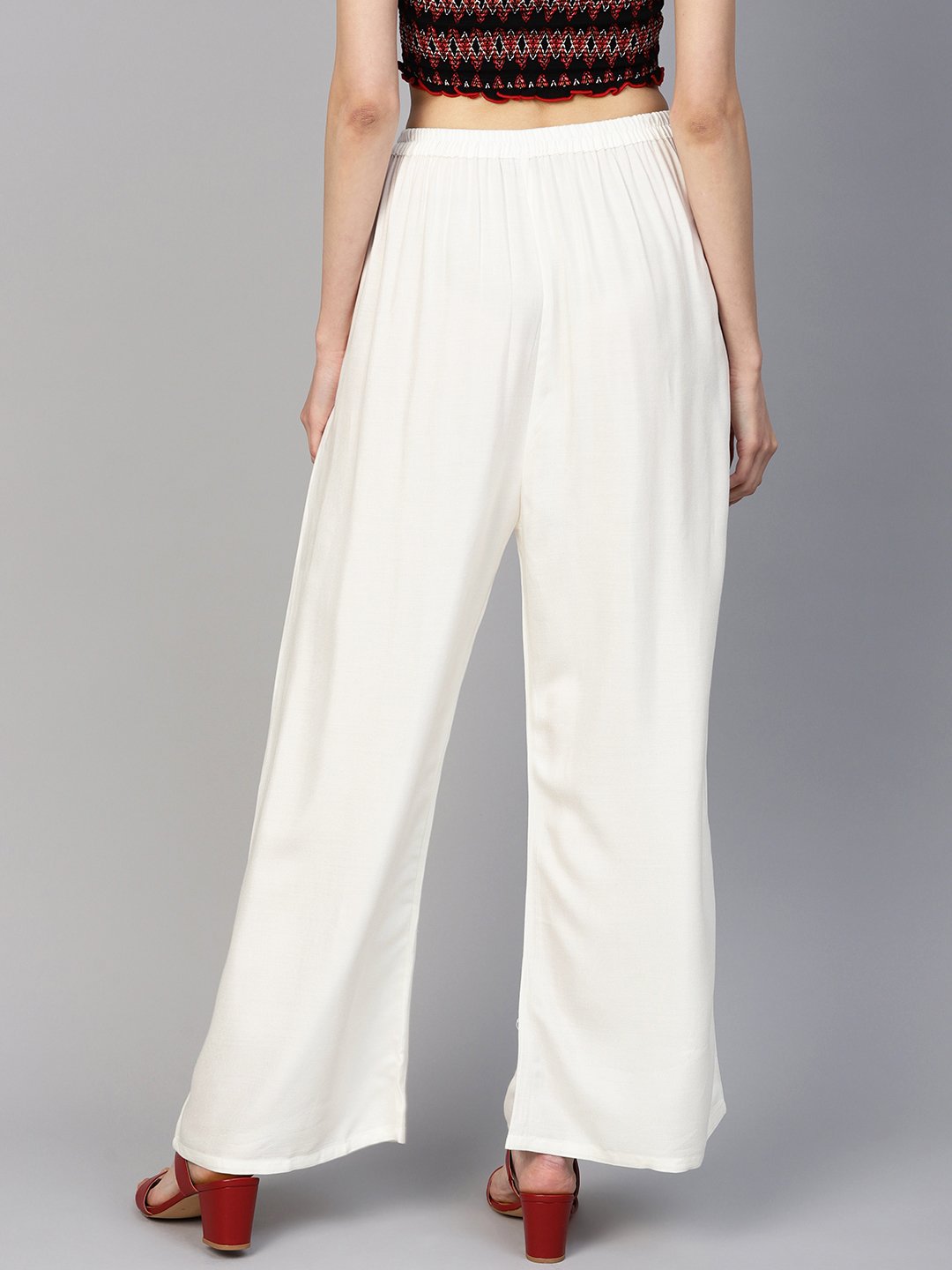 Jompers Women Off-White Solid Straight Palazzos | Grocsy