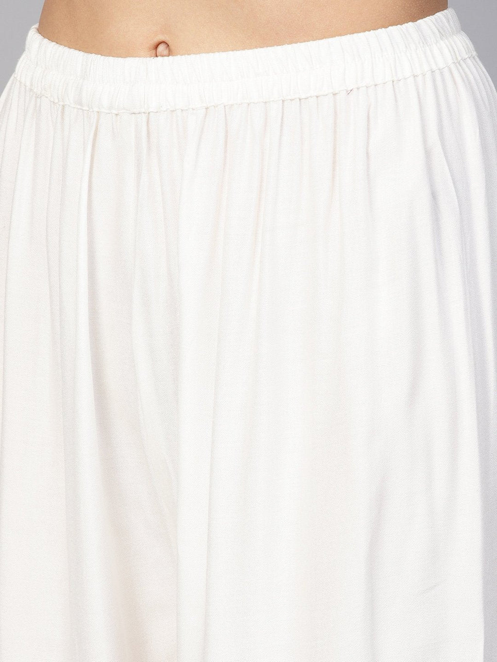 Jompers Women Off-White Solid Straight Palazzos | Grocsy