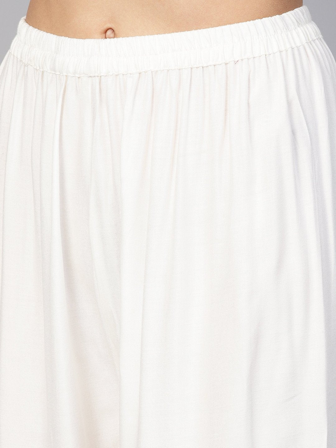 Jompers Women Off-White Solid Straight Palazzos | Grocsy