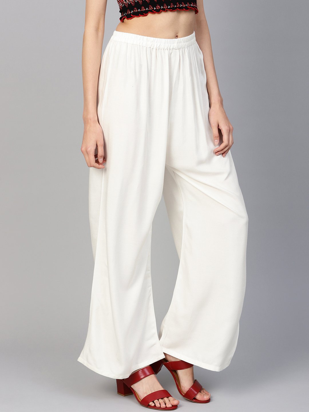 Jompers Women Off-White Solid Straight Palazzos | Grocsy