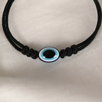 NVR Women & Men Black Evil Eye Rakhi With Roli Chawal | Grocsy