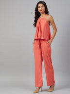 Jompers Women Peach-Coloured Solid Halter Neck Basic Jumpsuit | Grocsy