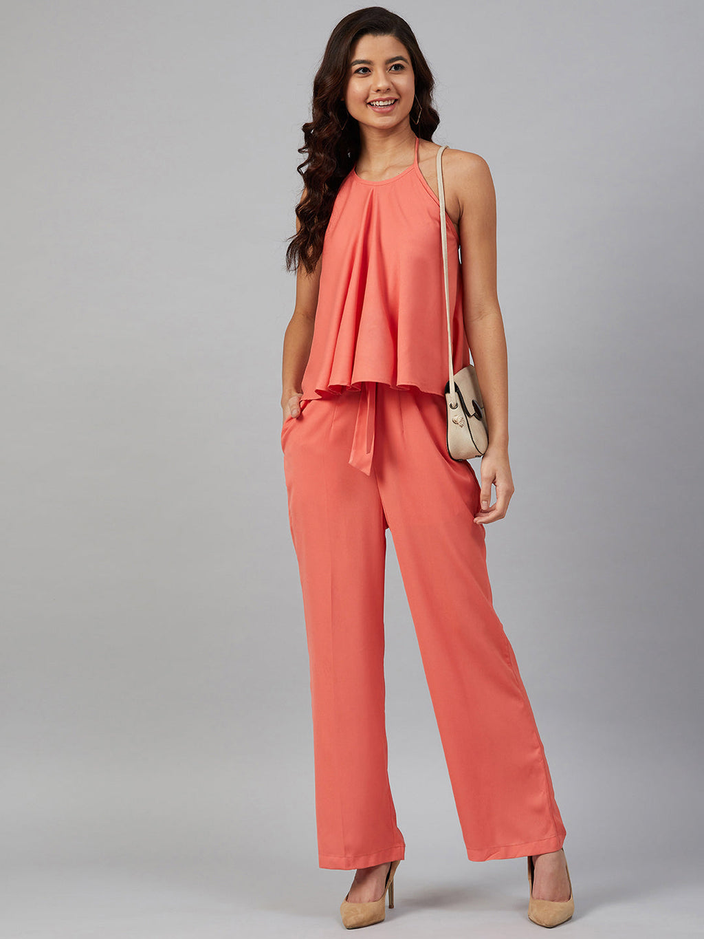 Jompers Women Peach-Coloured Solid Halter Neck Basic Jumpsuit | Grocsy