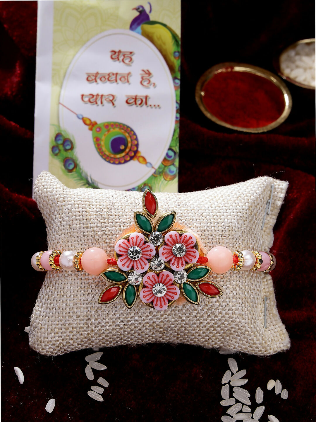 NVR Men Pink Floral Shape Stone-Studdded & Beaded Rakhi With Roli Chawal & Chocolate | Grocsy