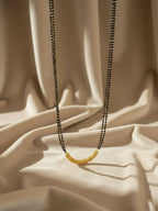 NVR Women Gold Plated Black Beaded Mangalsutra | Grocsy