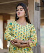 Kaajh Women's Yellow Floral Print Side Slit Cotton Kurta Pant Set | Grocsy