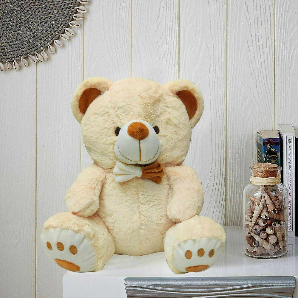 Webby Plush Cute Sitting Teddy Bear Soft Toys with Neck Bow and Foot Print (Beige) | Grocsy