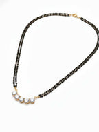 NVR Women Gold Plated Black Beaded Mangalsutra | Grocsy