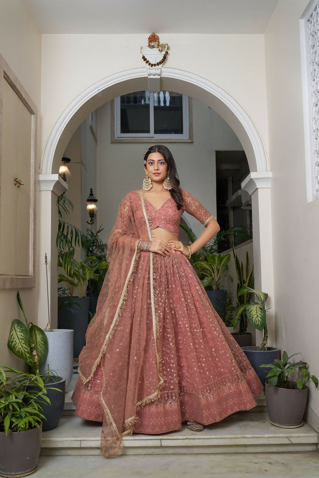 Eilara Glamorous Rust Butterfly Net With Tone To Tone Thread And Sequence Embroidered Work Lehenga Choli For Wedding | Grocsy