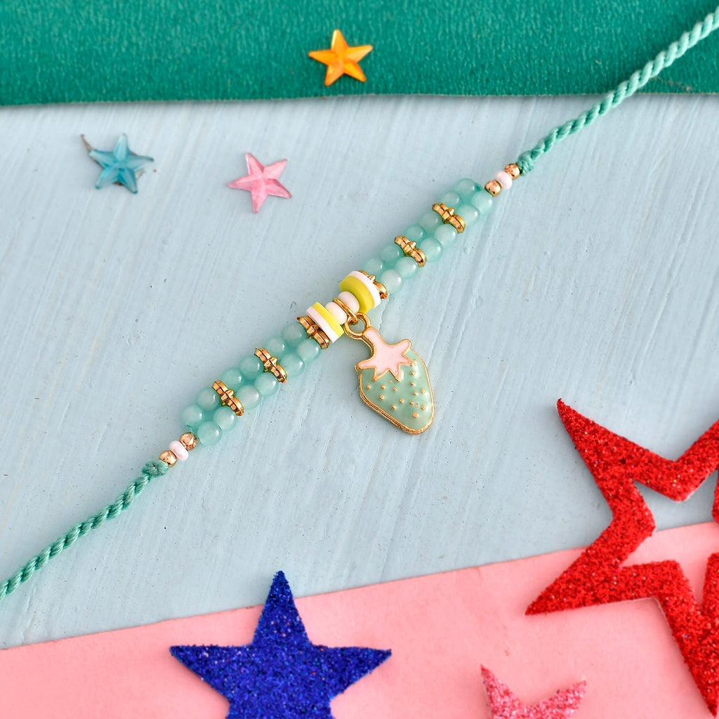 trueBrowns X Voylla Turquoise Beads Kid's Fruit Motif Rakhi For Kids | Grocsy