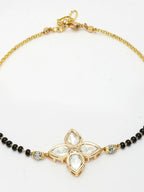 NVR Women Gold-Polished & Black Brass Stone-Studded Hand Mangalsutra Link Bracelet | Grocsy