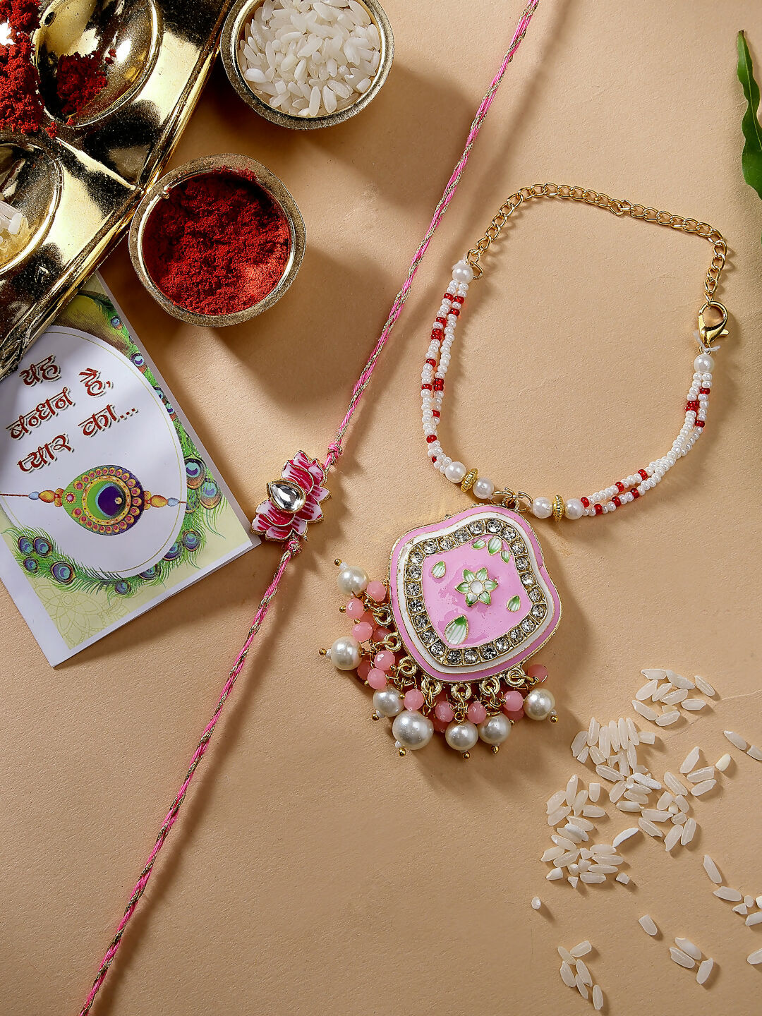 NVR Women & Men Set of 2 Pink Lotus Shape Kundan Stone-Studded & Beaded Bhaiya Bhabhi Rakhi With Roli Chawal & Chocolate | Grocsy
