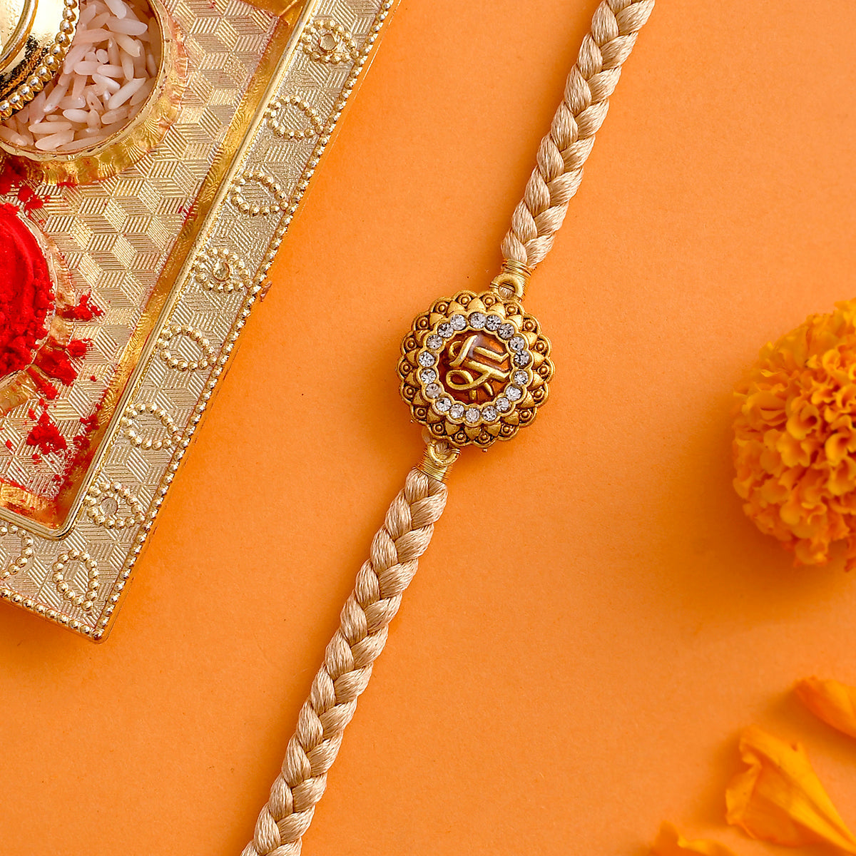 trueBrowns X Voylla Traditional Shree Inscription Zirconia Studded Rakhi | Grocsy