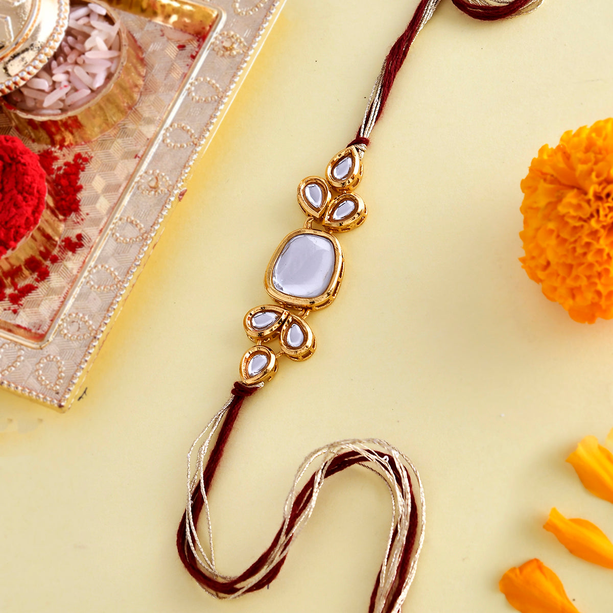 trueBrowns X Voylla Classic Kundan Polki Studded Ethnic Thread Rakhi | Grocsy