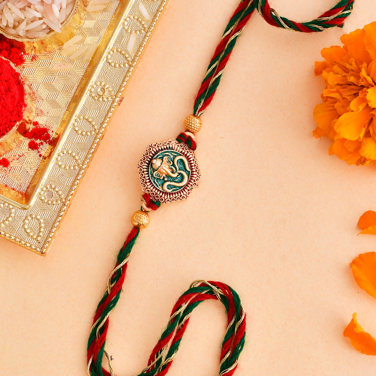 trueBrowns X Voylla Traditional Om And Lord Ganesha Motif Thread Rakhi | Grocsy