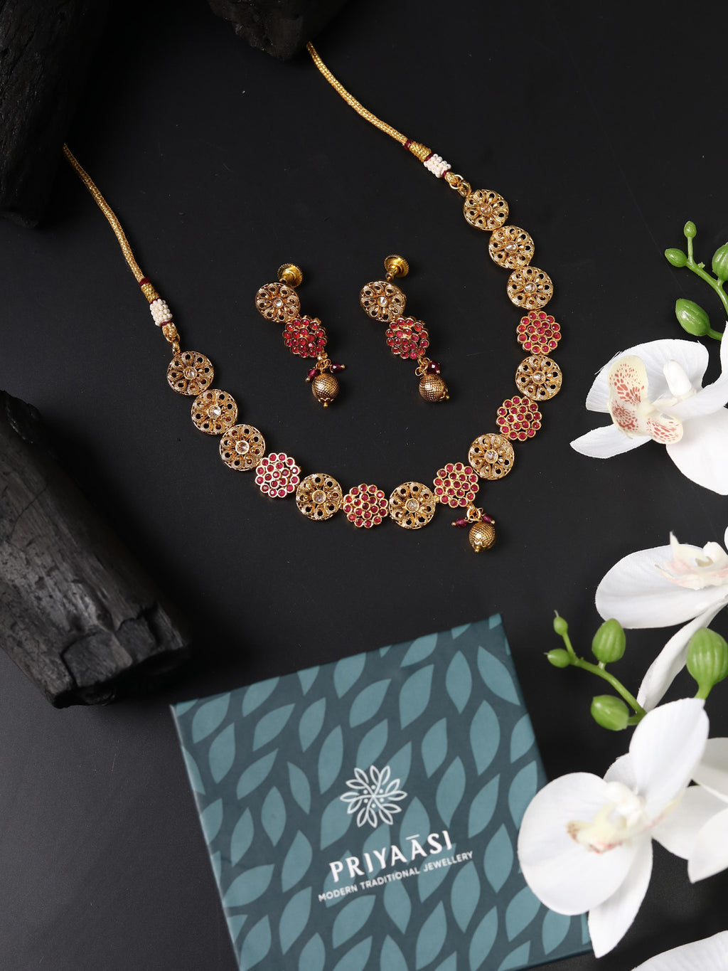 Priyaasi Women Ruby Kundan Pearls Gold-Polished Jewellery Set - Swadesiicart