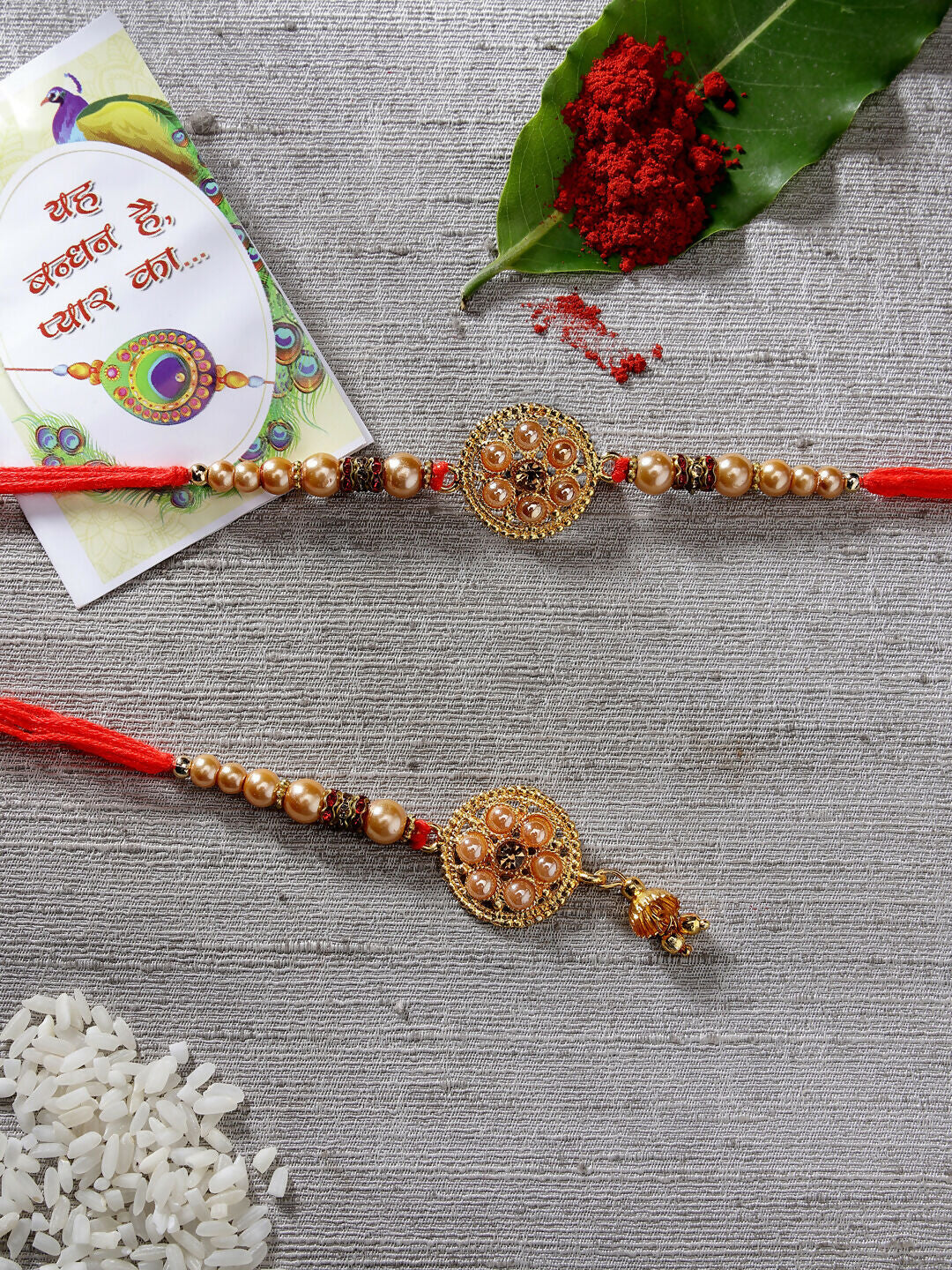 NVR Women & Men Set of 2 Gold-Toned Bhaiya Bhabi Rakhi With Roli Chawal & Chocolate | Grocsy