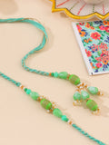 NVR Set of 2 Green Artificial Beads Bhaiya Bhabhi Rakhi with Roli Chawal Chandan & Mishri | Grocsy