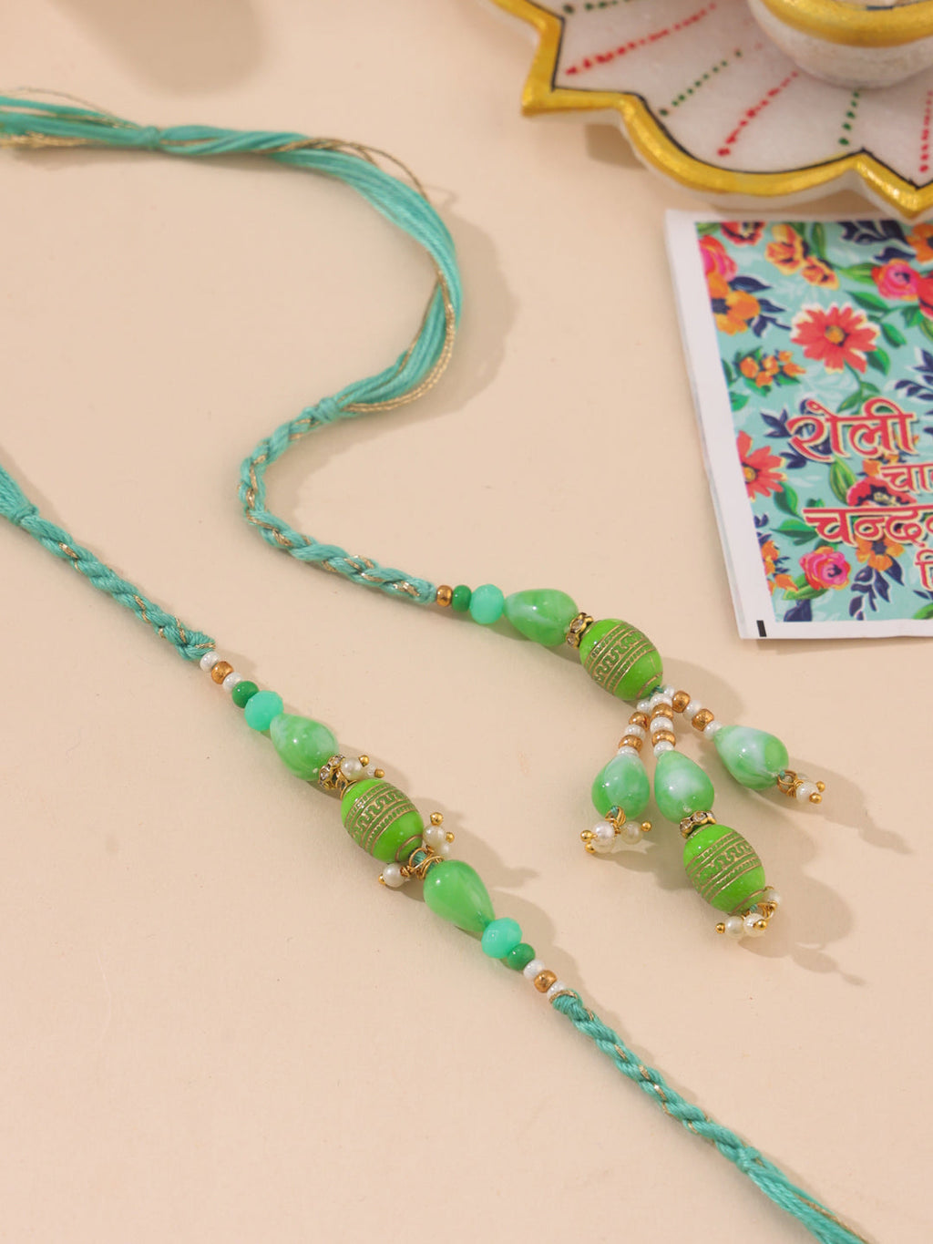 NVR Set of 2 Green Artificial Beads Bhaiya Bhabhi Rakhi with Roli Chawal Chandan & Mishri | Grocsy