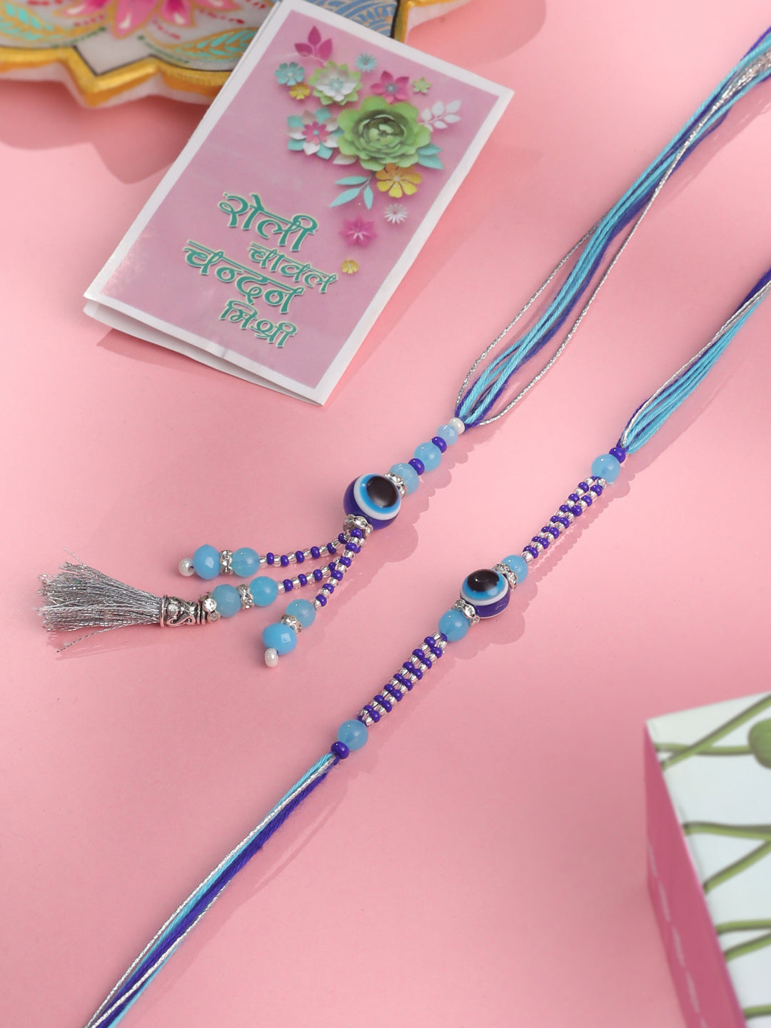 NVR Set of 2 Blue Evil Eye Artificial Beads Bhaiya Bhabhi Rakhi with Roli Chawal Chandan & Mishri | Grocsy