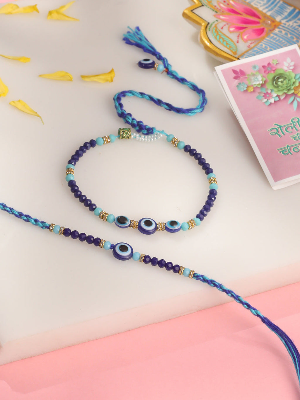 NVR Set of 2 Blue Evil Eye Artificial Beads Bhaiya Bhabhi Rakhi with Roli Chawal Chandan & Mishri | Grocsy