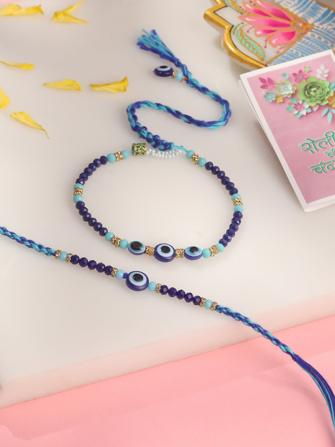 NVR Set of 2 Blue Evil Eye Artificial Beads Bhaiya Bhabhi Rakhi with Roli Chawal Chandan & Mishri | Grocsy