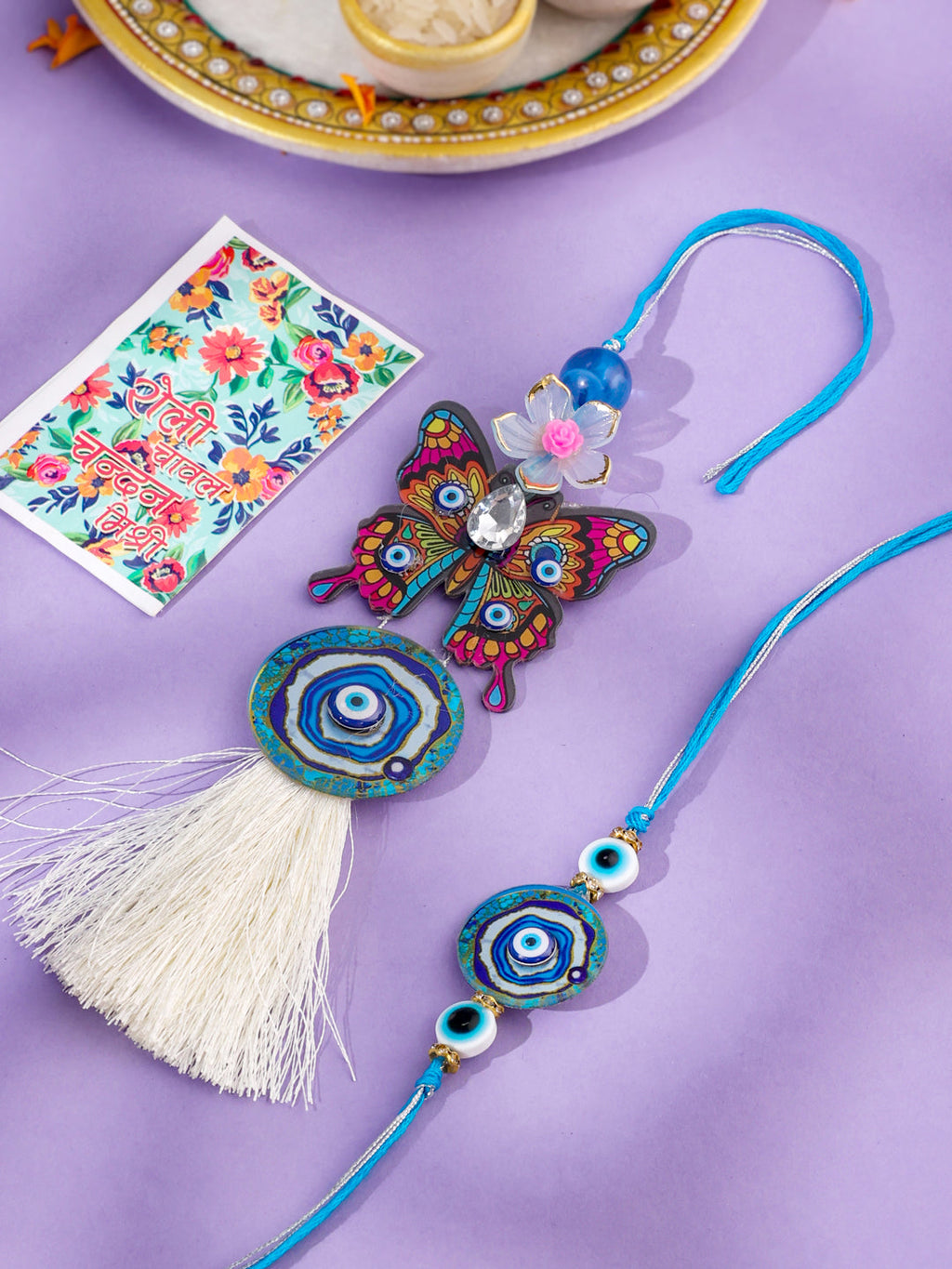 NVR Blue Evil Eye Artificial Beads Set of 2 Bhaiya Bhabhi Rakhi with Roli Chawal Chandan & Mishri | Grocsy