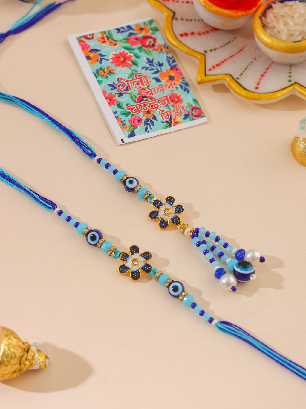 NVR Set of 2 Blue Artificial Beads Evil Eye Bhaiya Bhabhi Rakhi with Roli Chawal Chandan & Mishri | Grocsy