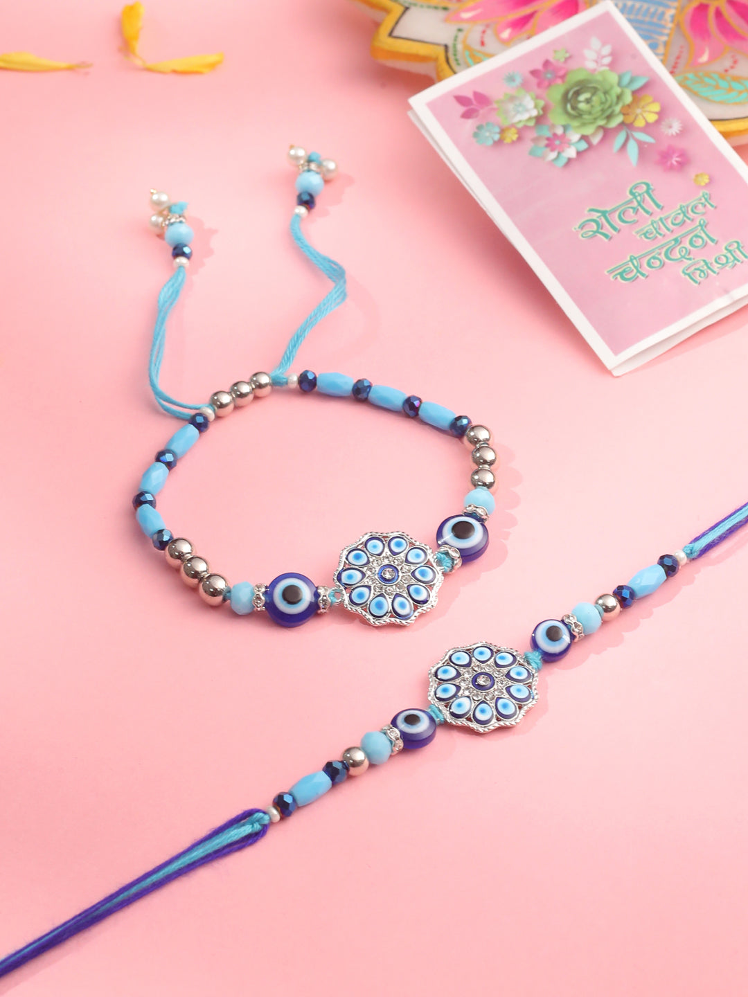 NVR Set of 2 Blue Evil Eye Floral Design Bhaiya Bhabhi Rakhi with Roli Chawal Chandan & Mishri | Grocsy