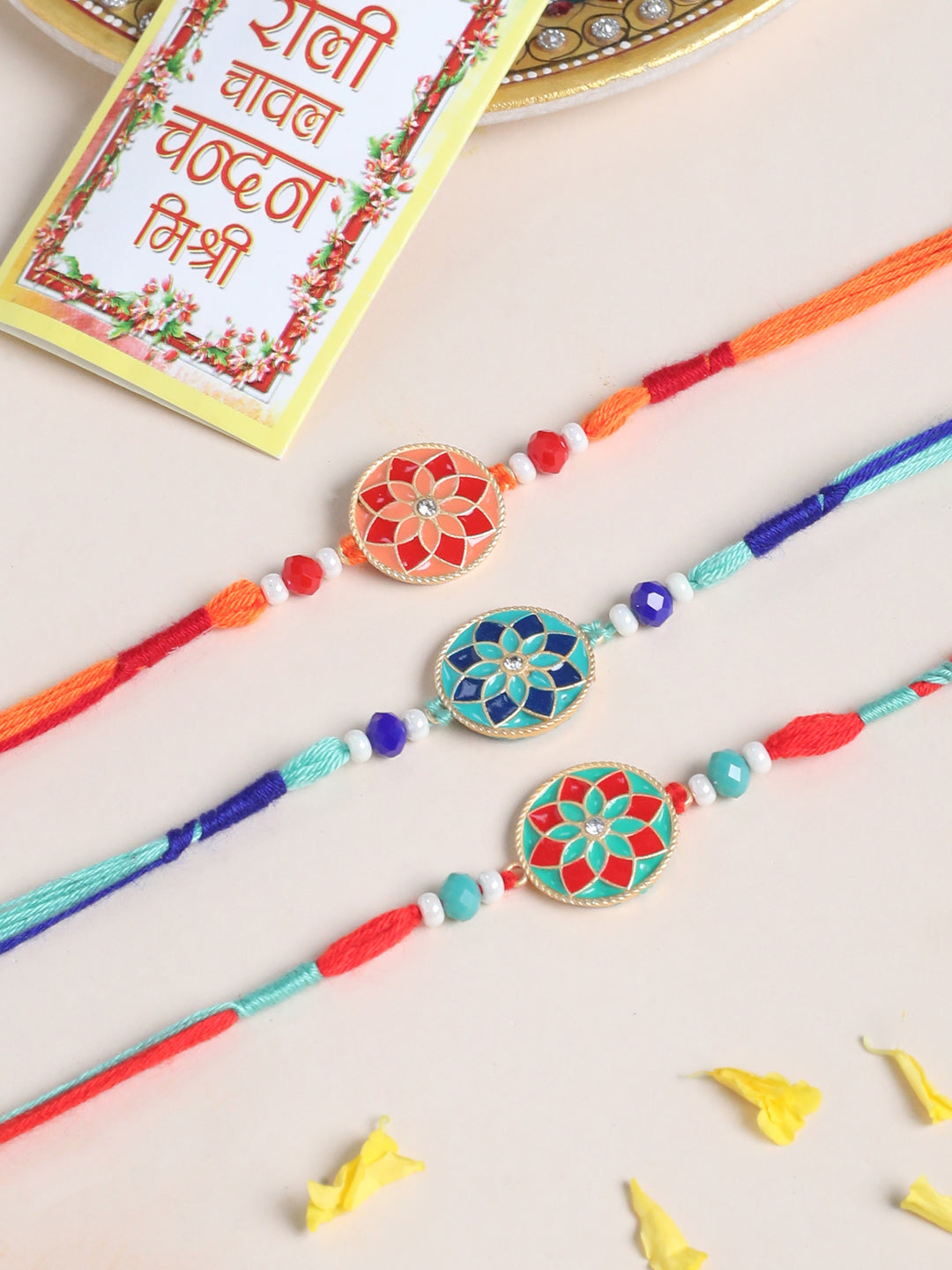 NVR Men Set of 3 Floral Design Multicolor Artificial Beads Thread Rakhi with Roli Chawal Chandan & Mishri | Grocsy
