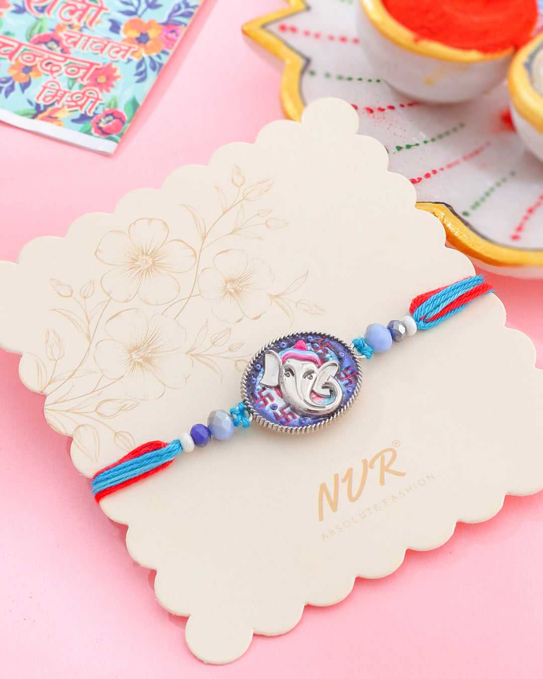 NVR Men Red & Blue Ganesh Ji Thread Rakhi with Roli Chawal Chandan & Mishri | Grocsy