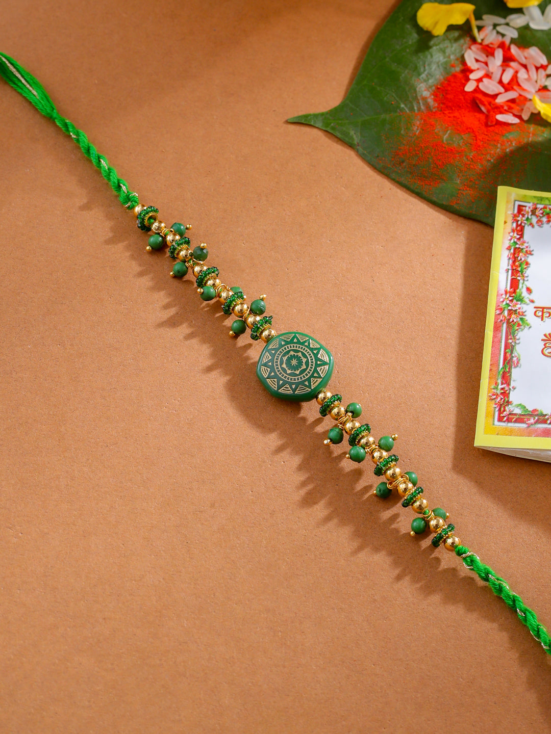 NVR Men Green Artificial Beads Round Shape Thread Rakhi with Roli Chawal Chandan & Mishri | Grocsy