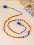 NVR Men Evil Eye Multicolor Thread Rakhi with Roli Chawal Chandan & Mishri | Grocsy