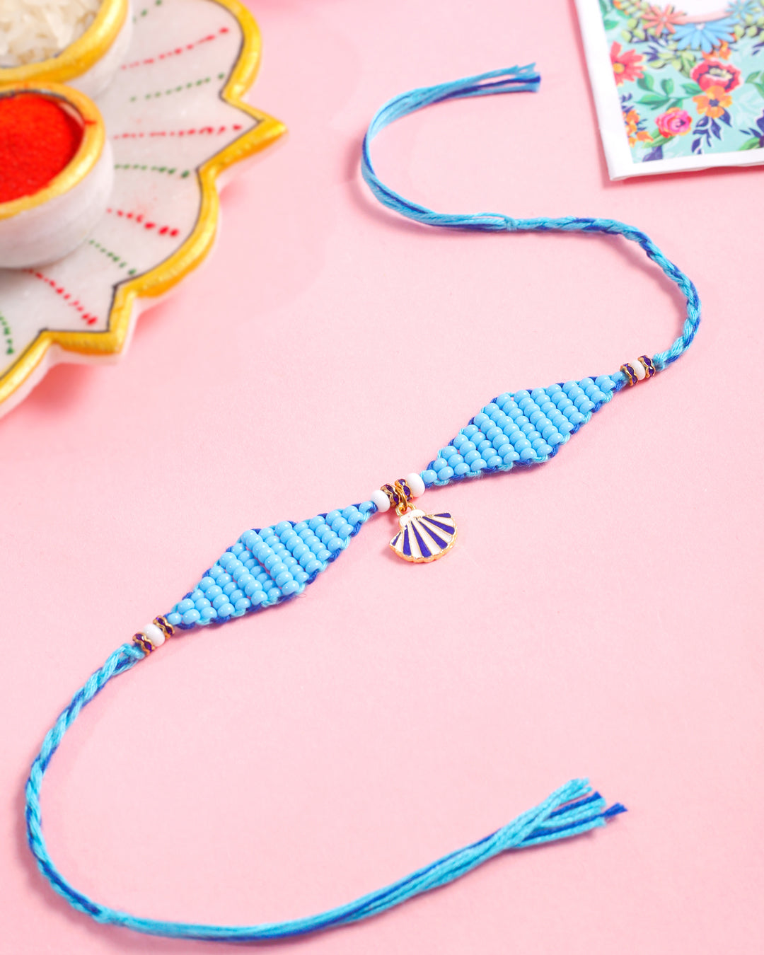 NVR Men Blue Pearls Unique Design Thread Rakhi with Roli Chawal Chandan & Mishri | Grocsy