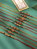 NVR Men Set of 10 Floral Design Red Artificial Stones and Beads Thread Rakhi with Roli Chawal Chandan & Mishri | Grocsy