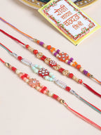 NVR Men Set of 4 Floral Design Multicolor Artificial Stones and Beads Thread Rakhi with Roli Chawal Chandan & Mishri | Grocsy