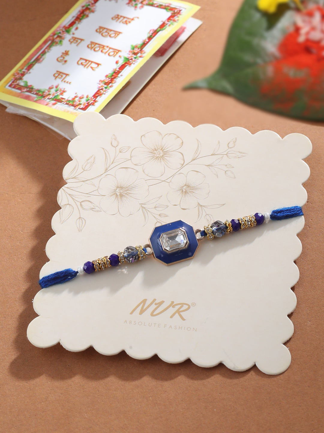 NVR Men Blue Artificial Stones Handmade Thread Rakhi with Roli Chawal Chandan & Mishri | Grocsy