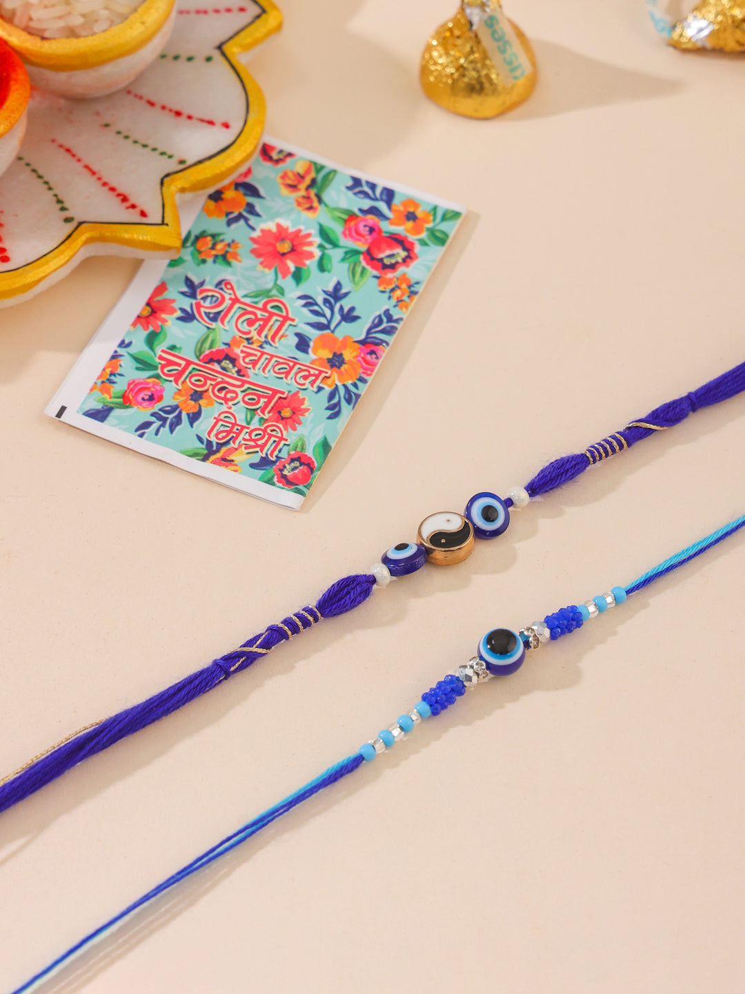 NVR Men Set of 2 Blue Evil Eye Artificial Beads Thread Rakhi with Roli Chawal Chandan & Mishri | Grocsy