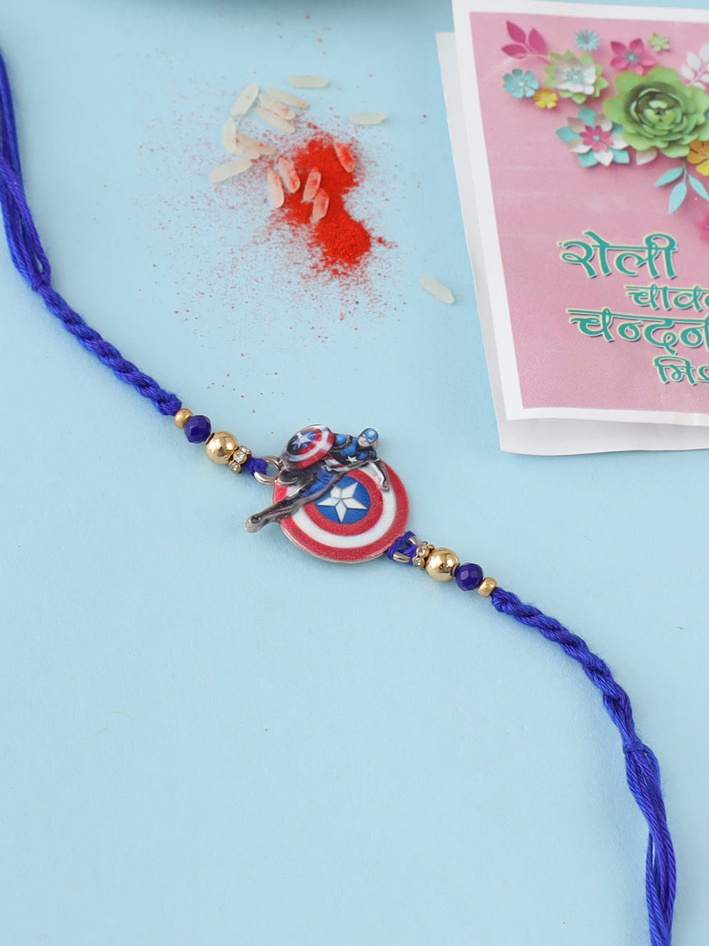 NVR Kids Superhero Blue Artificial Beads Thread Rakhi with Roli Chawal Chandan & Mishri | Grocsy