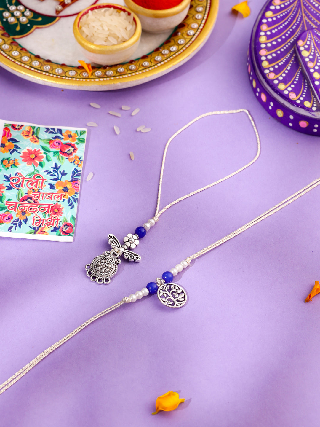 NVR Set of 2 Silver Toned Pearls & Beads Bhaiya Bhabhi Rakhi with Roli Chawal Chandan & Mishri | Grocsy
