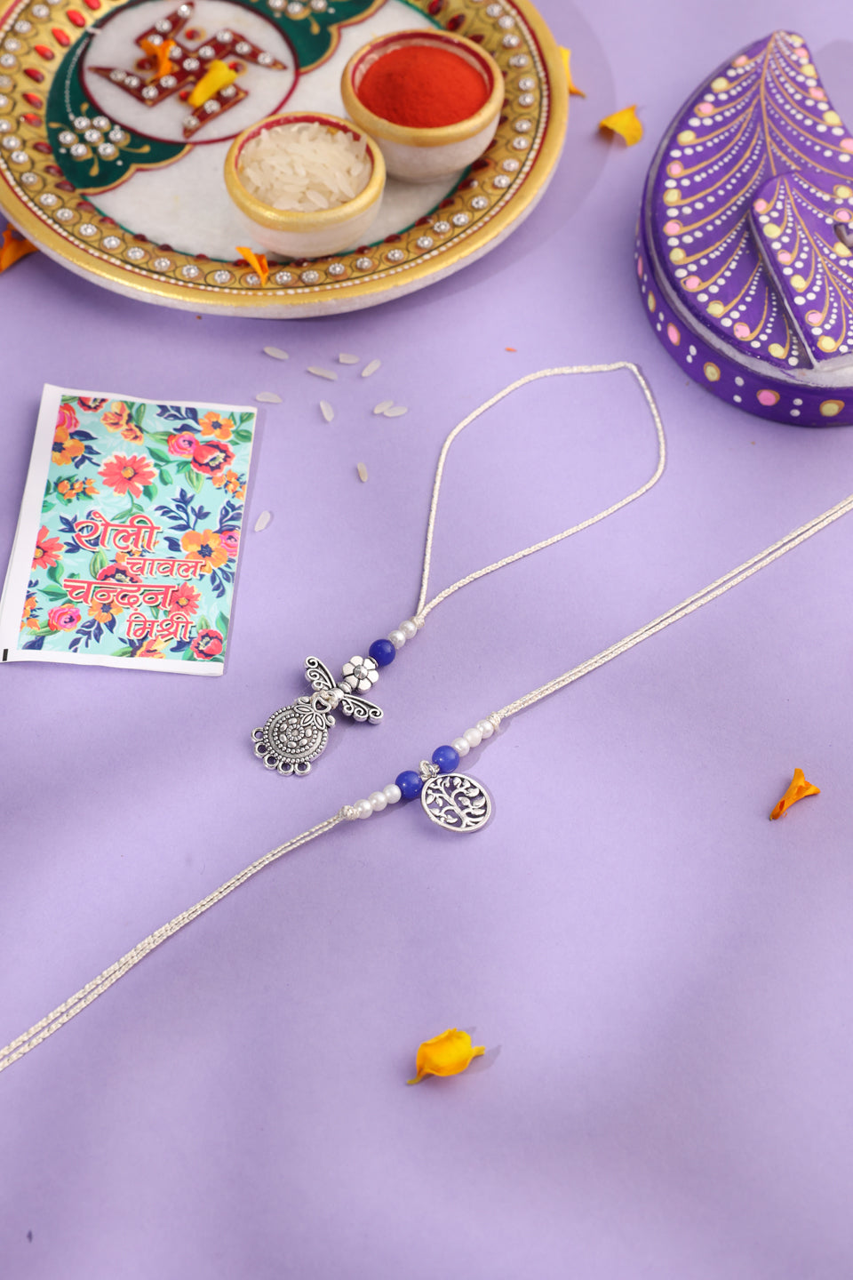 NVR Set of 2 Silver Toned Pearls & Beads Bhaiya Bhabhi Rakhi with Roli Chawal Chandan & Mishri | Grocsy