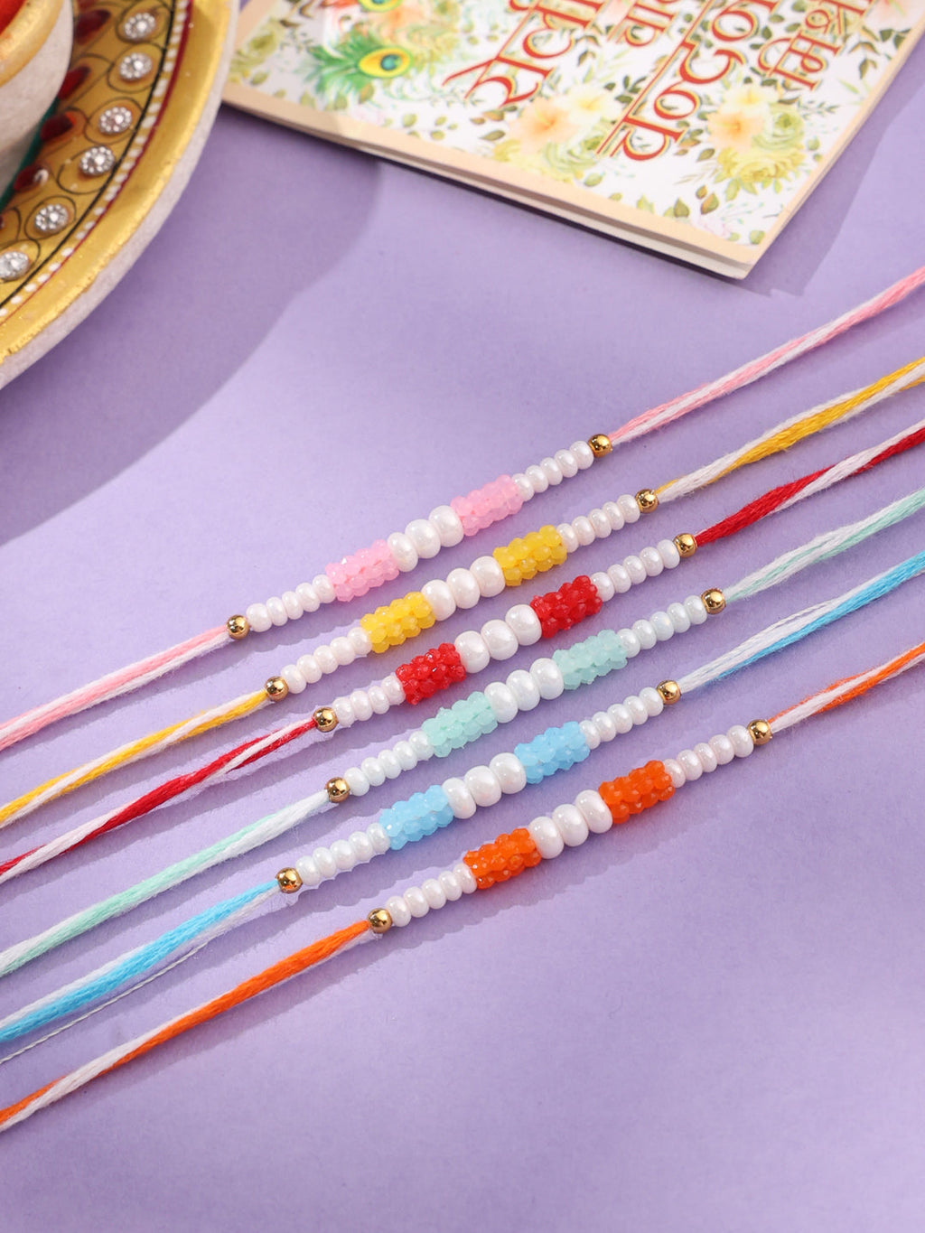 NVR Men Set of 6 Multicolor Pearls Thread Rakhi with Roli Chawal Chandan & Mishri | Grocsy