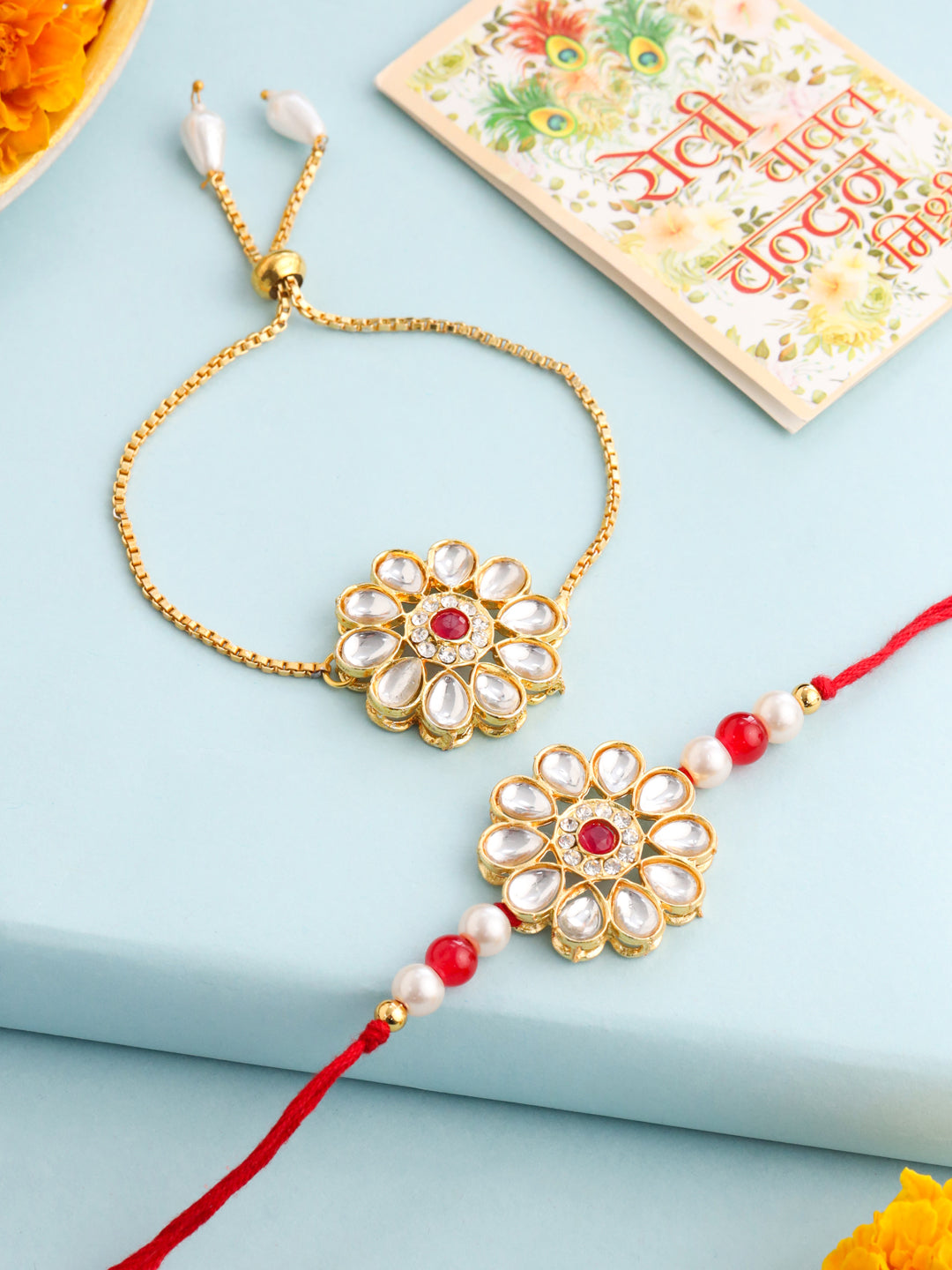 NVR Set of 2 Gold Toned Kundan Studded Floral Design Bhaiya Bhabhi Rakhi Set with Roli Chawal Chandan & Mishri | Grocsy