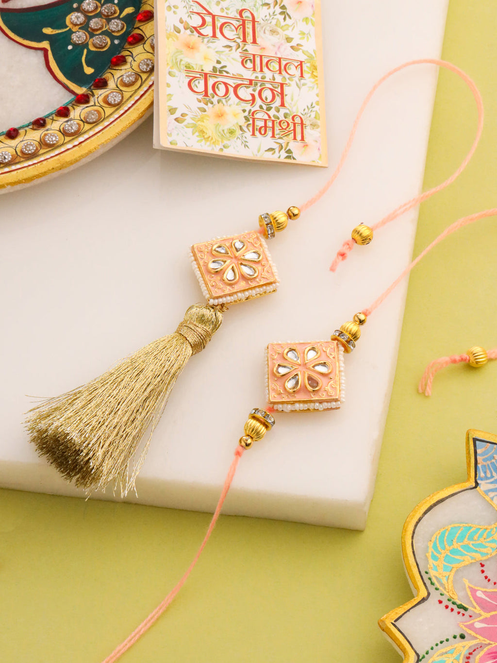 NVR Set of 2 Handmade Peach Kundan Studded Bhaiya Bhabhi Rakhi Set with Roli Chawal Chandan & Mishri | Grocsy