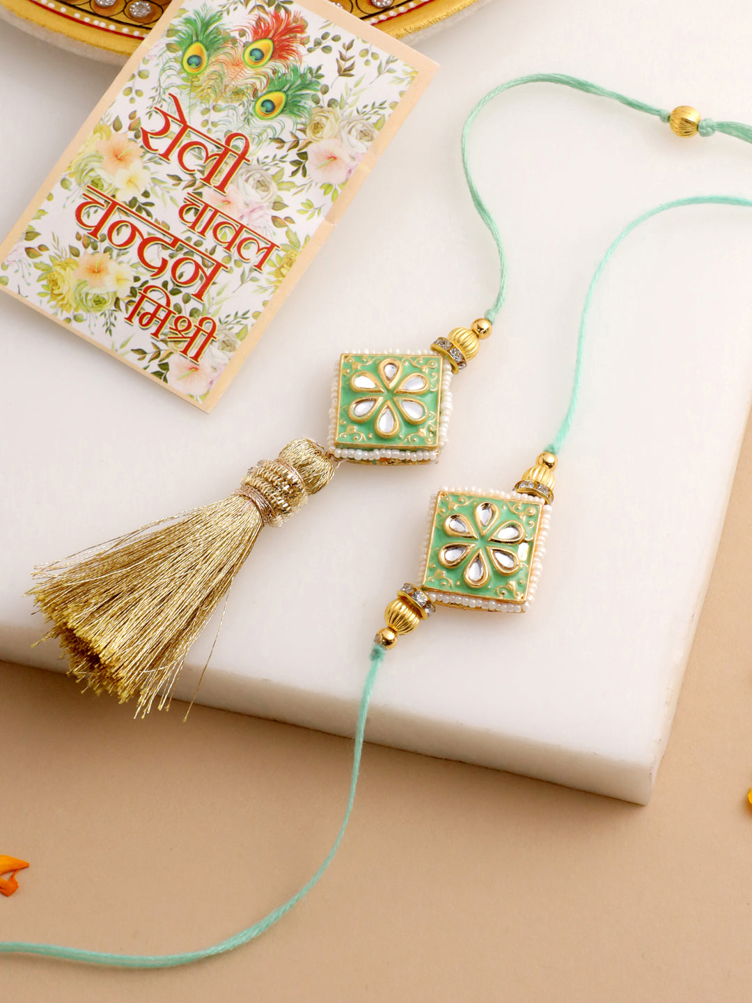 NVR Set of 2 Handmade Sea Green Kundan Studded Bhaiya Bhabhi Rakhi Set with Roli Chawal Chandan & Mishri | Grocsy