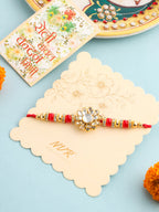 NVR Men Red Kundan Studded Floral Design Thread Rakhi with Roli Chawal Chandan & Mishri | Grocsy