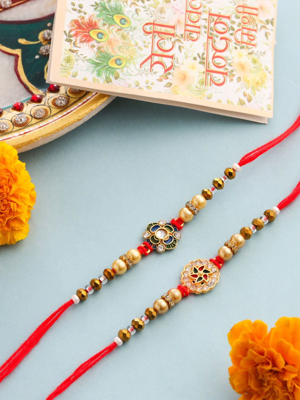 NVR Men Set of 2 Red & Gold Floral Design Artificial Stones & Beads Thread Rakhi With Roli Chawal Chandan & Mishri | Grocsy