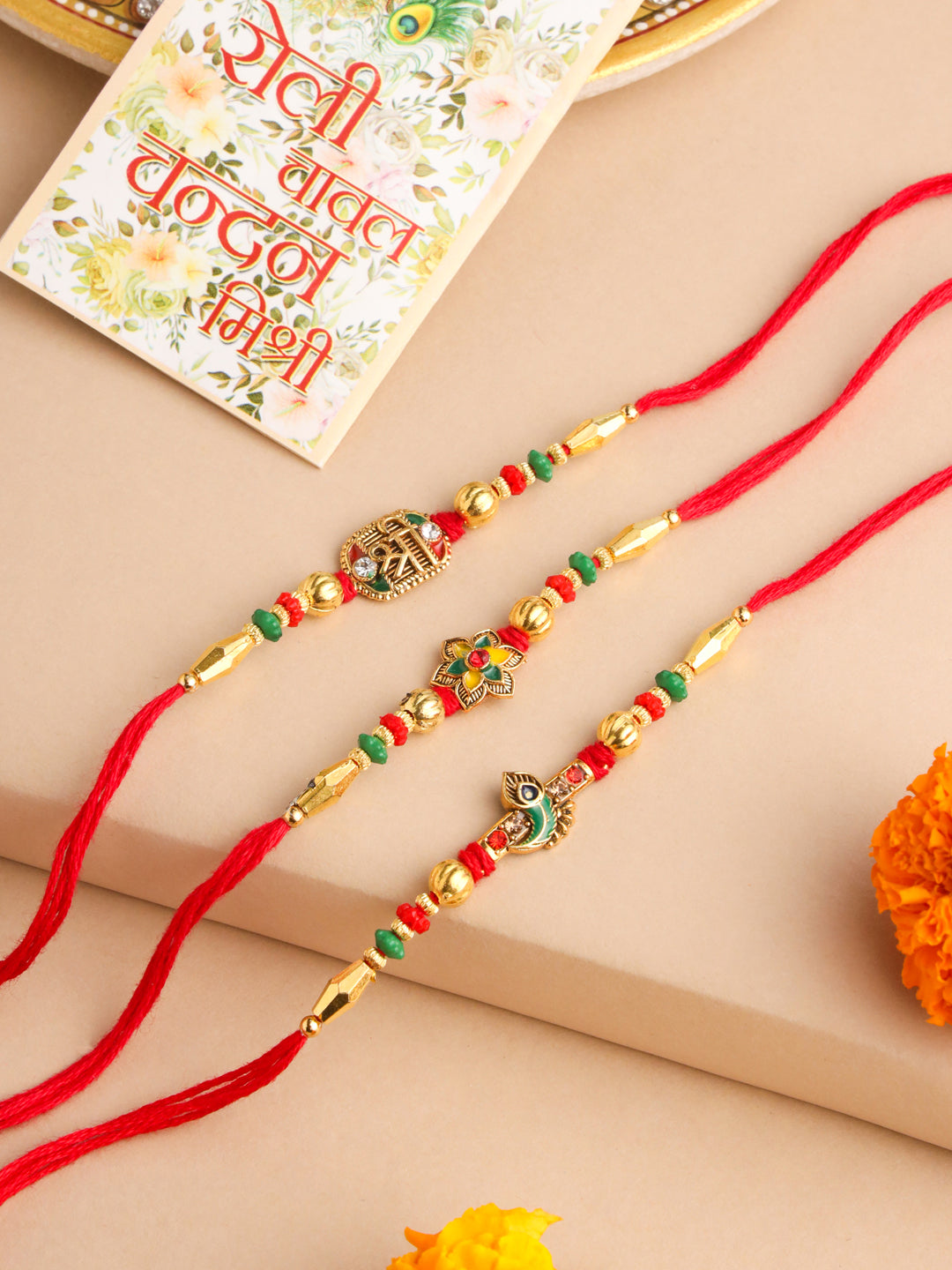 NVR Men Set of 3 Red & Gold Floral Design Artificial Stones and Beads Thread Rakhi With Roli Chawal Chandan & Mishri | Grocsy