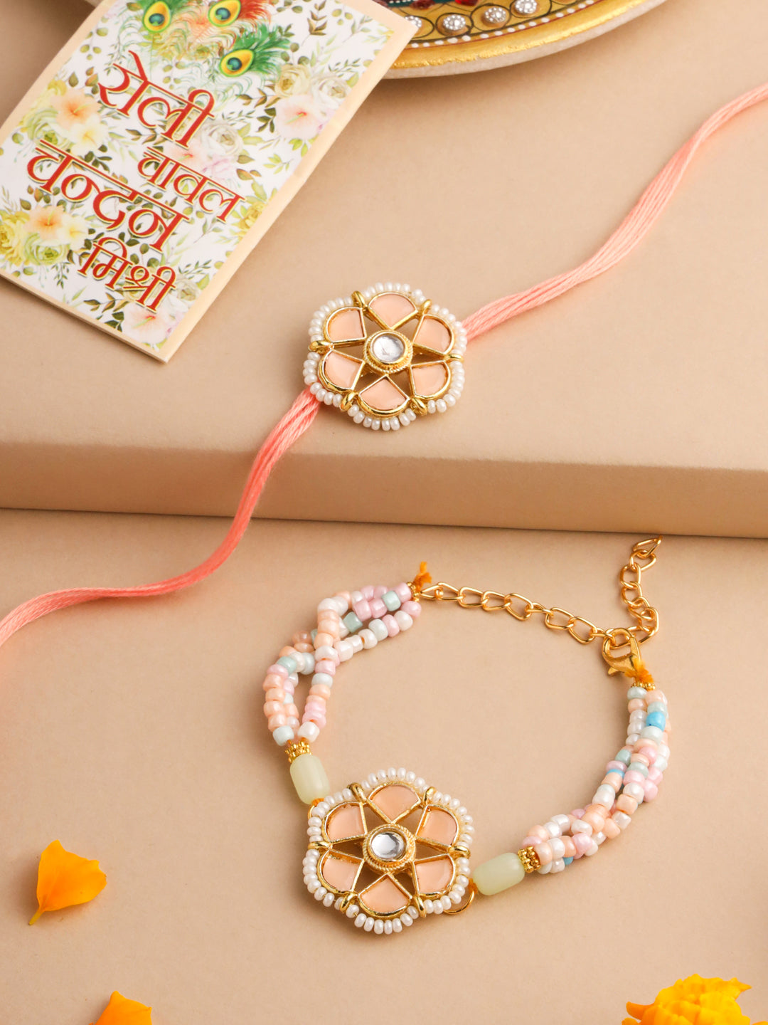NVR Set of 2 Peach Color Artificial Stones & Pearls Bhaiya Bhabhi Rakhi With Roli Chawal Chandan & Mishri | Grocsy